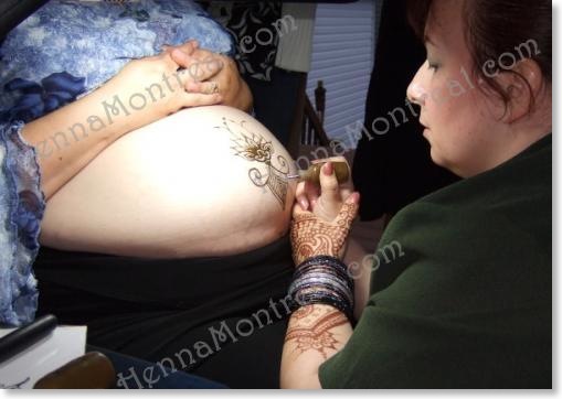 Capucine doing pre-natal henna body art